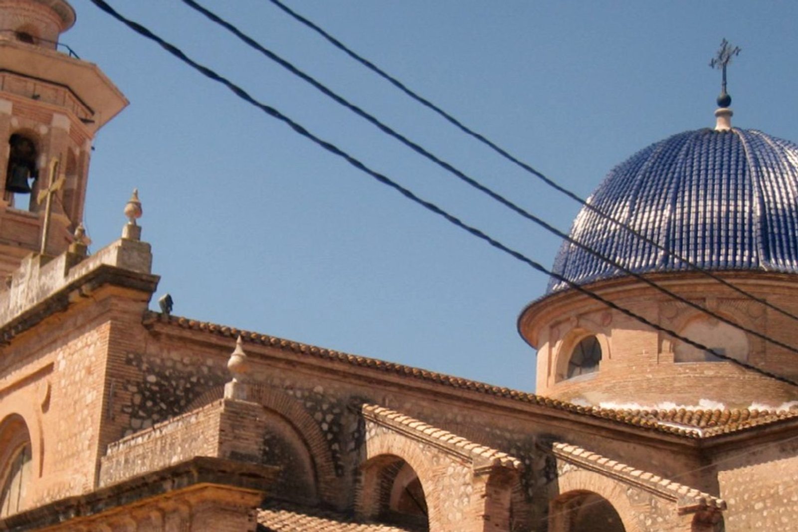 The blue-domed church in Xaló village against a clear sky